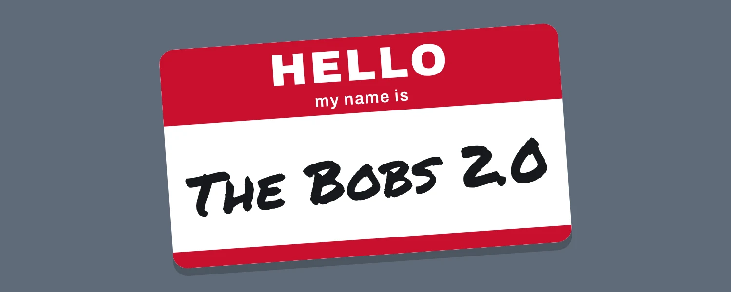 A red Hello my name is sticker with The Bobs 2.0 written on it in black marker.